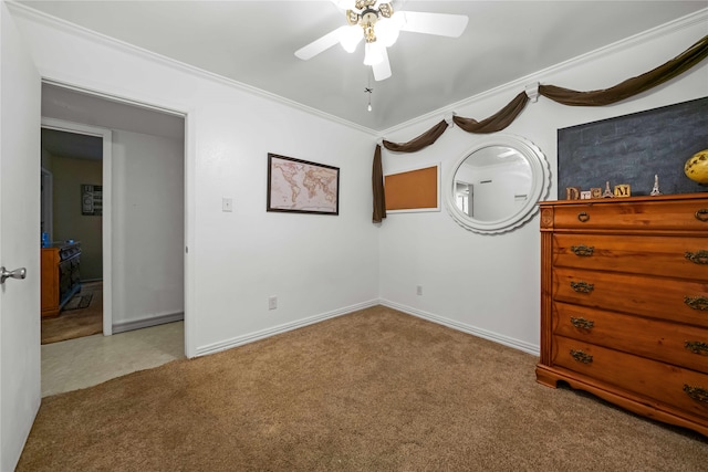 unfurnished bedroom featuring ornamental molding, light colored carpet, and ceiling fan