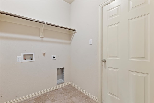 washroom featuring hookup for an electric dryer, light tile patterned floors, washer hookup, and gas dryer hookup