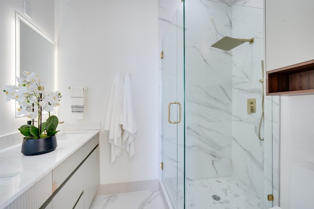 bathroom featuring vanity and a shower with shower door