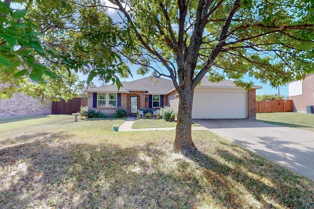 single story home with a garage and a front lawn