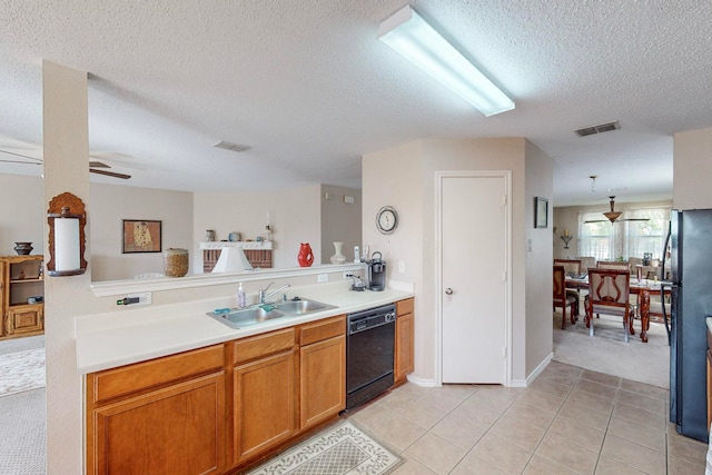 kitchen with black appliances, sink, light tile patterned flooring, a textured ceiling, and ceiling fan