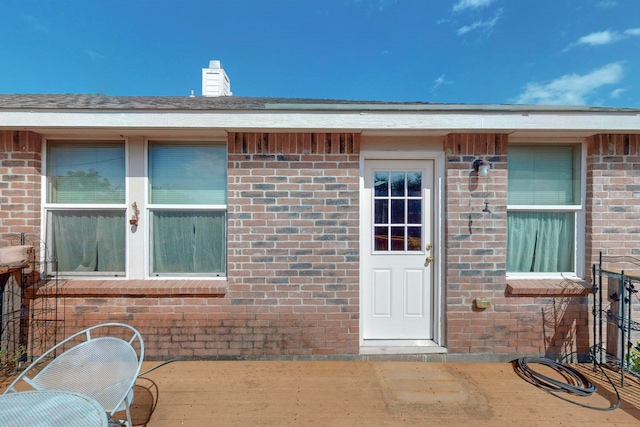 doorway to property featuring a patio area