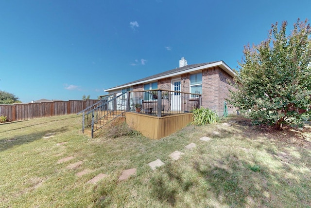 view of yard with a wooden deck