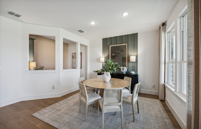 dining area with dark hardwood / wood-style floors