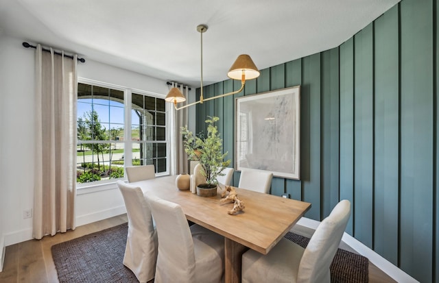 dining space with dark hardwood / wood-style floors