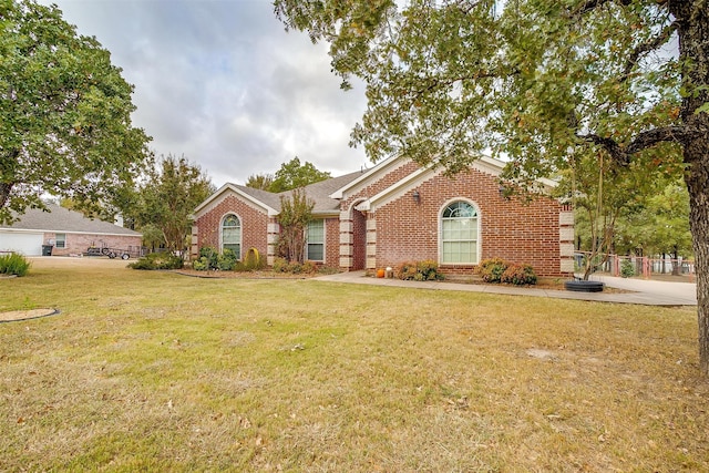 ranch-style house with a front lawn