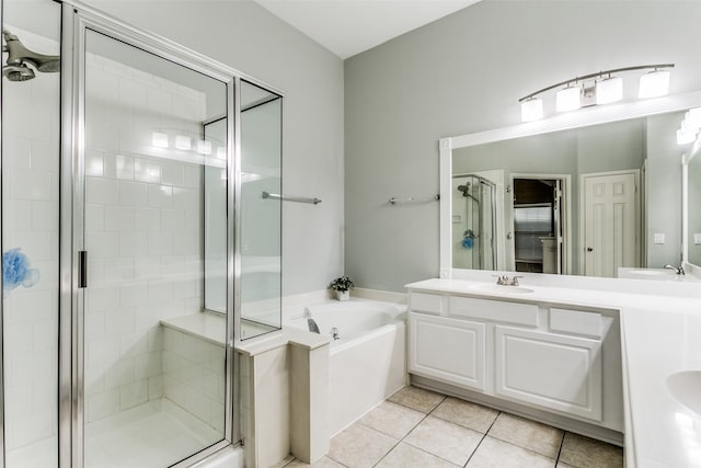 bathroom featuring vanity, independent shower and bath, and tile patterned flooring