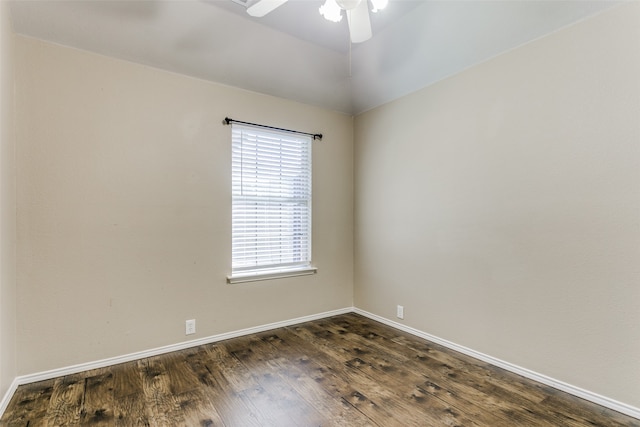 spare room featuring ceiling fan and dark hardwood / wood-style flooring