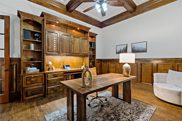 home office with ceiling fan, coffered ceiling, beam ceiling, ornamental molding, and dark hardwood / wood-style floors