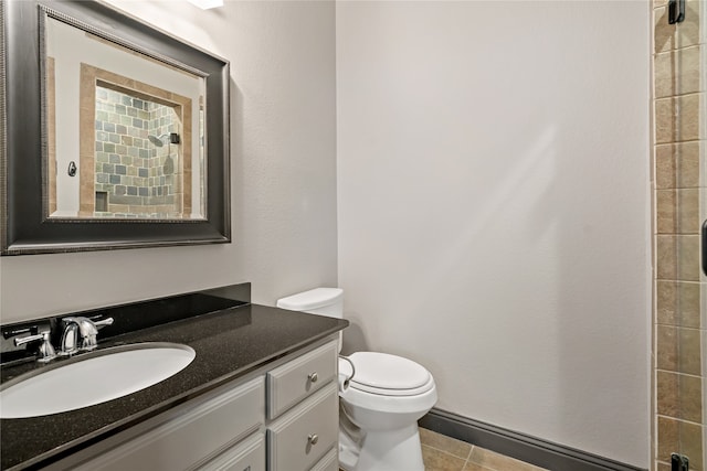 bathroom featuring vanity, toilet, and tile patterned floors