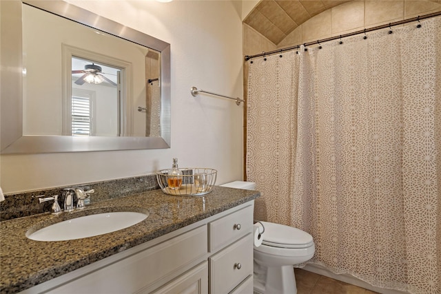 bathroom with ceiling fan, curtained shower, vanity, tile patterned floors, and toilet