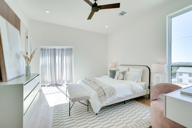 bedroom featuring light hardwood / wood-style flooring and ceiling fan