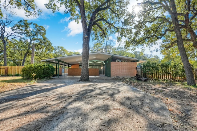 view of front of home with a carport