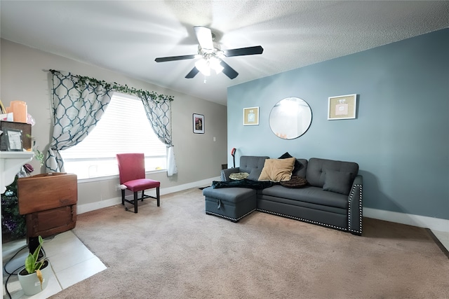 living room with a textured ceiling, light colored carpet, and ceiling fan