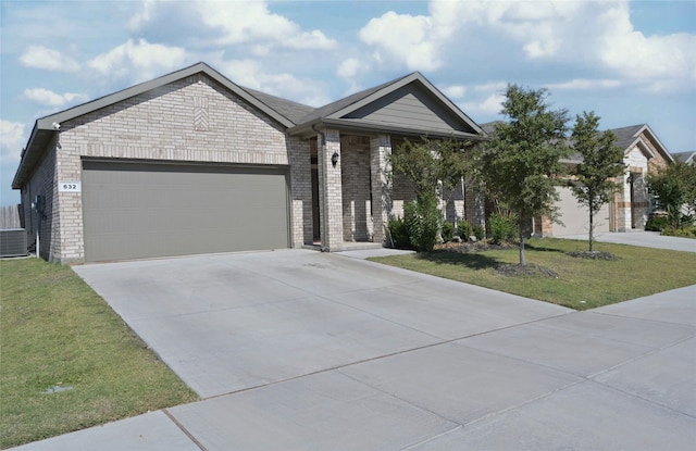 ranch-style home featuring a front lawn and a garage