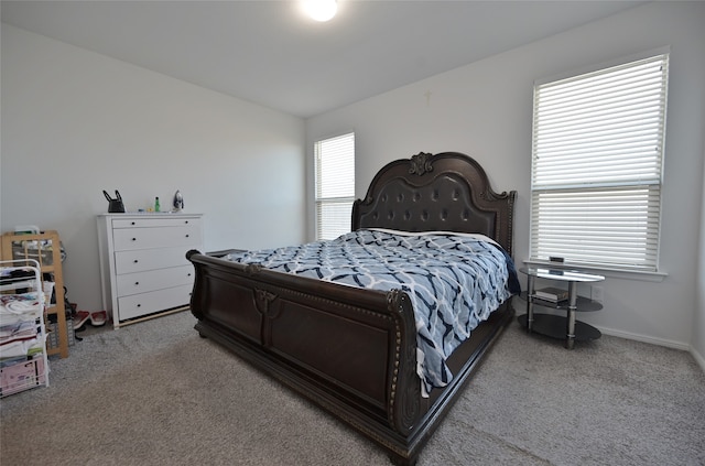 bedroom featuring light carpet