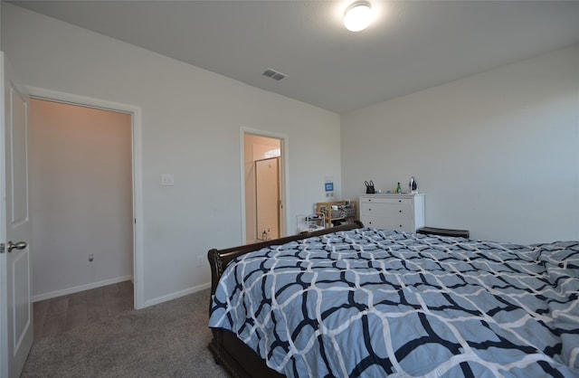 unfurnished bedroom with dark colored carpet