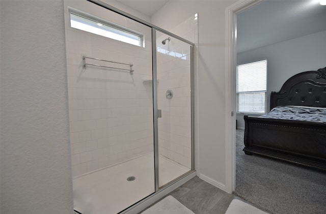 bathroom with a healthy amount of sunlight and an enclosed shower