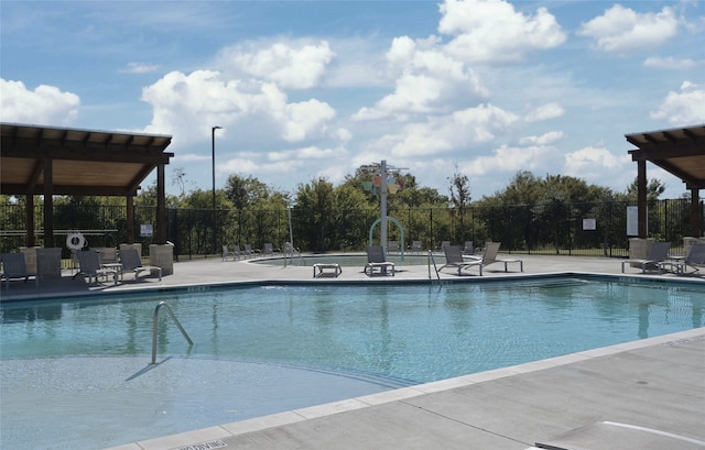 view of swimming pool featuring a patio