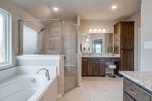 bathroom featuring vanity, independent shower and bath, and plenty of natural light