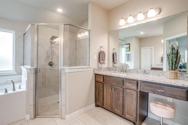 bathroom with vanity, independent shower and bath, and tile patterned flooring