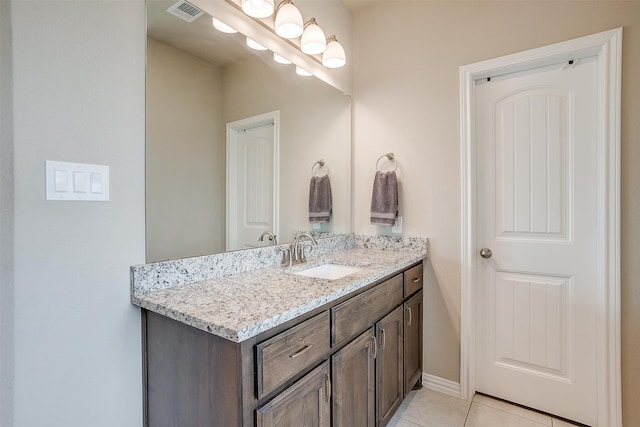 bathroom featuring vanity and tile patterned flooring