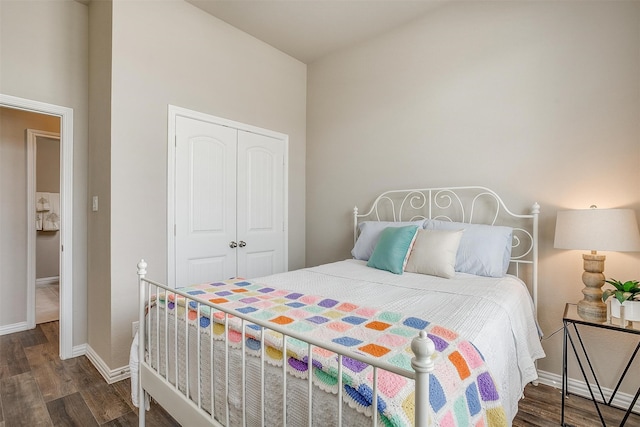 bedroom featuring a closet and dark hardwood / wood-style flooring