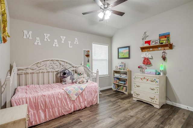 bedroom with dark wood-type flooring, vaulted ceiling, and ceiling fan