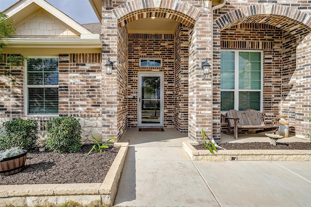 entrance to property with a patio