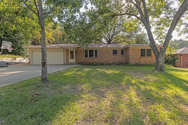 ranch-style home with a garage and a front lawn