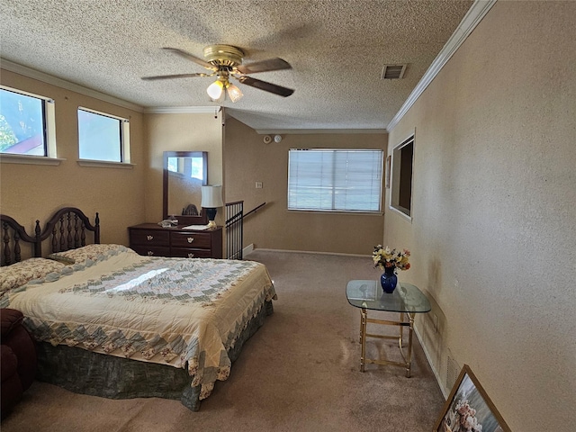 bedroom with ceiling fan, carpet, a textured ceiling, and ornamental molding