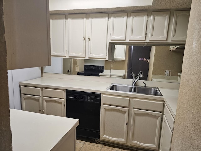 kitchen featuring sink, light tile patterned floors, and black appliances