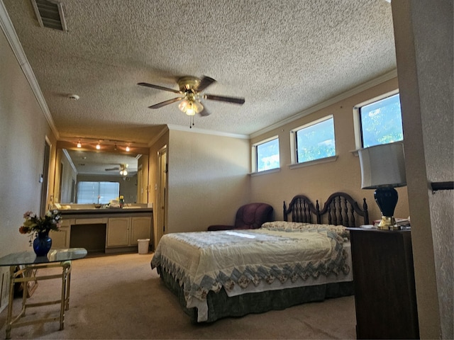 carpeted bedroom featuring crown molding, ceiling fan, and a textured ceiling