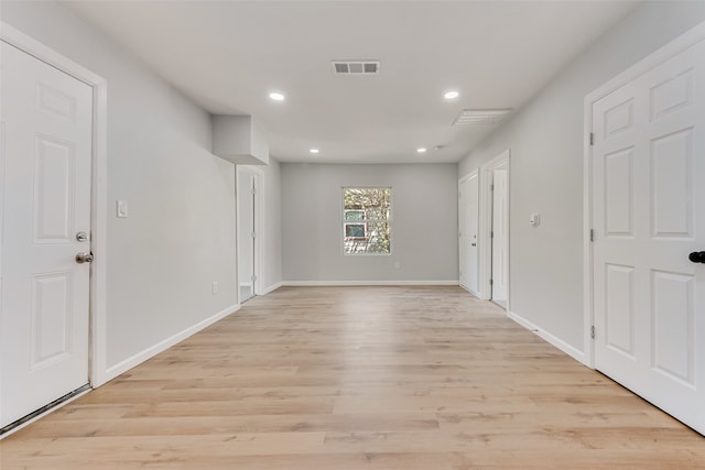 spare room with light hardwood / wood-style floors