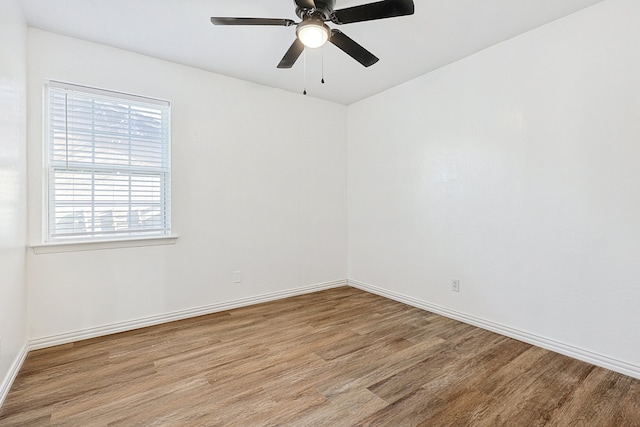 empty room featuring ceiling fan and light wood-type flooring