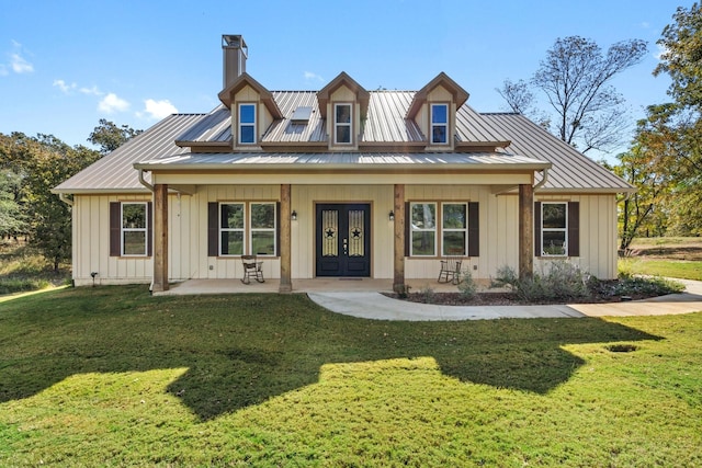 view of front of home with french doors, a porch, and a front yard