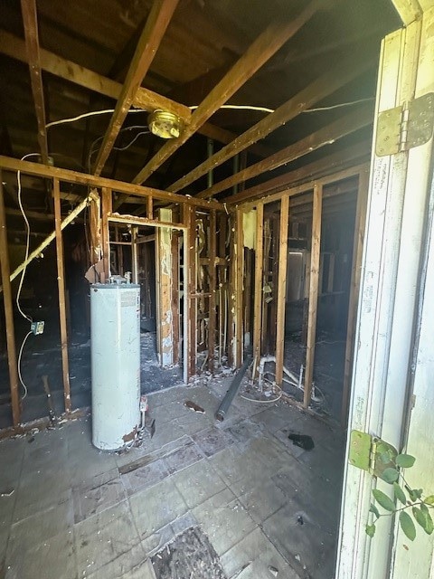 misc room featuring gas water heater