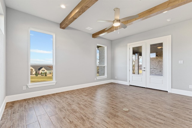 unfurnished room with ceiling fan, beam ceiling, and light hardwood / wood-style flooring