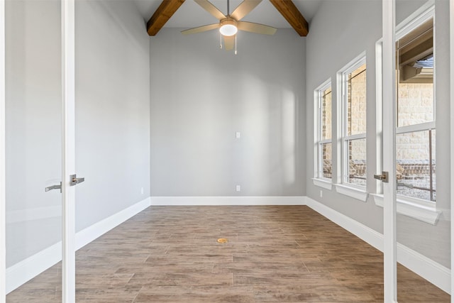 unfurnished room featuring beam ceiling, ceiling fan, and hardwood / wood-style flooring