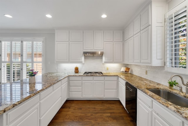 kitchen featuring black dishwasher, sink, and white cabinetry