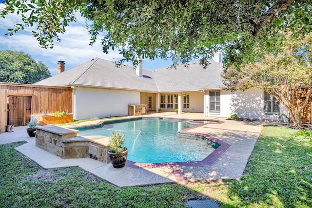 view of pool featuring a yard and a patio