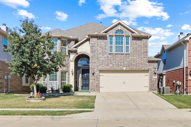 view of front facade featuring a garage and a front lawn