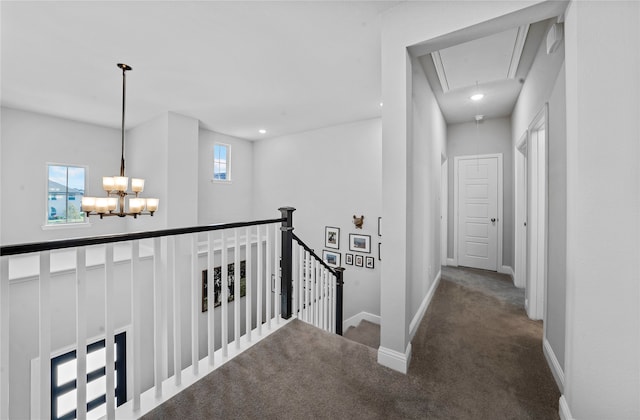 corridor with carpet floors and plenty of natural light