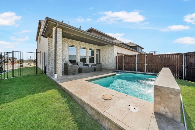 view of pool with a patio, outdoor lounge area, a yard, and pool water feature