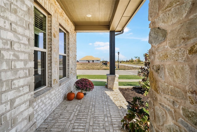 view of patio featuring a porch