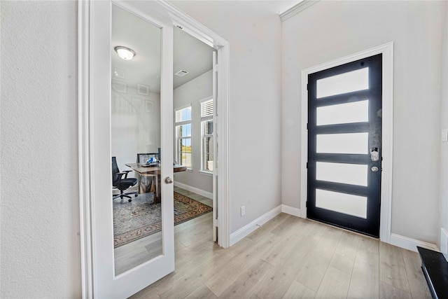 entrance foyer featuring light wood-type flooring