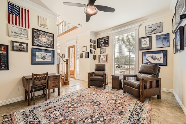 living area with ceiling fan, ornamental molding, and light tile patterned floors