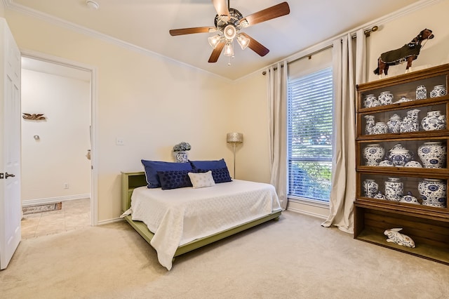 bedroom with crown molding, carpet flooring, and ceiling fan