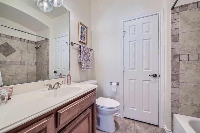 full bathroom with vanity, toilet, tile patterned floors, and tiled shower / bath combo