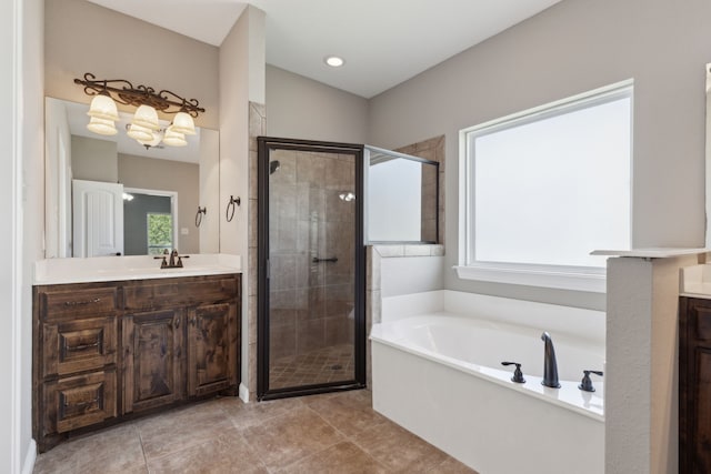 bathroom with vanity, shower with separate bathtub, and tile patterned floors